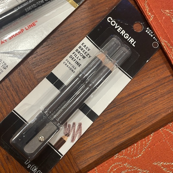 Revlon liquid eye liner and covergirl brow pencils . Both are black . - Picture 3 of 3